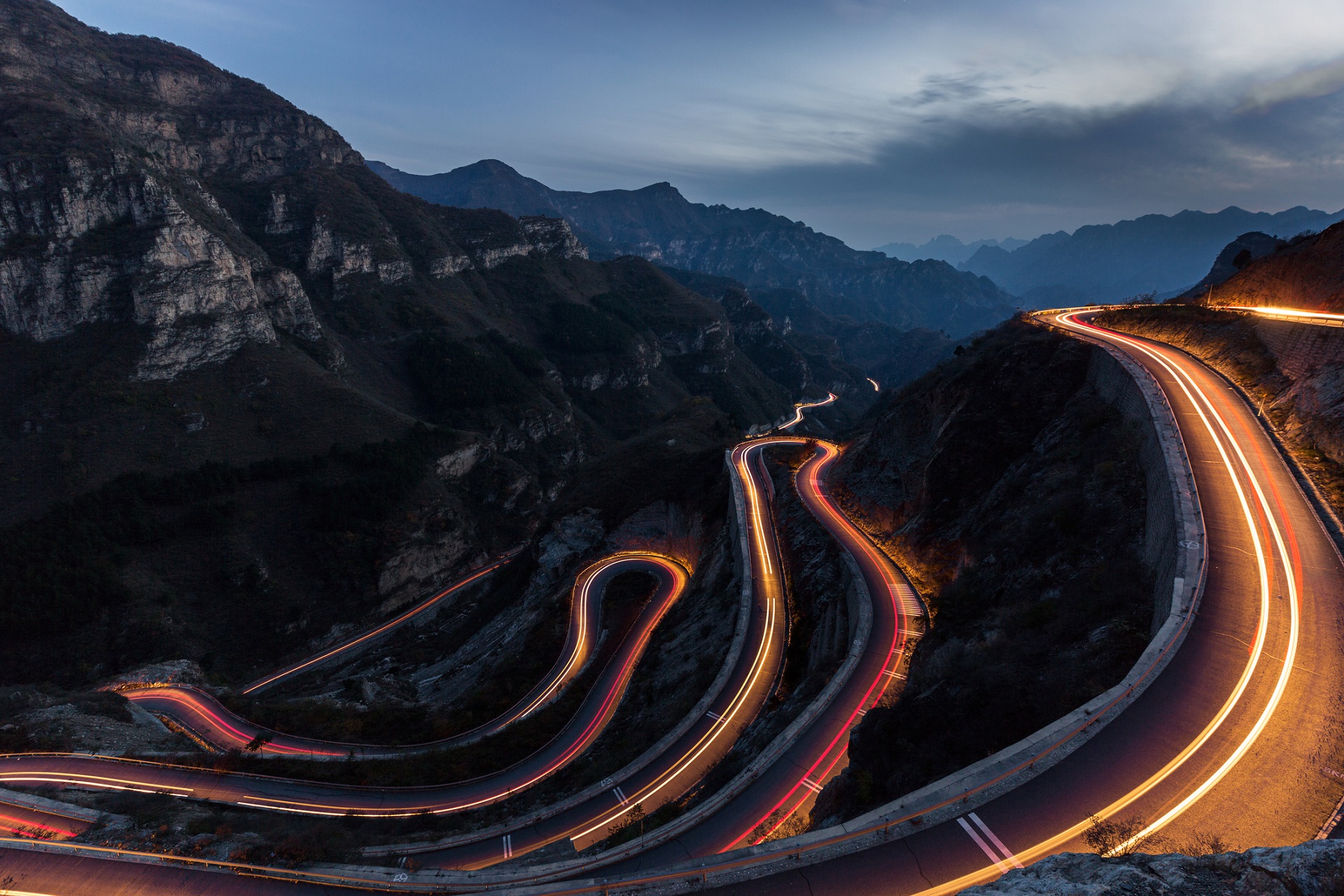 winding road with hairpin bends at night